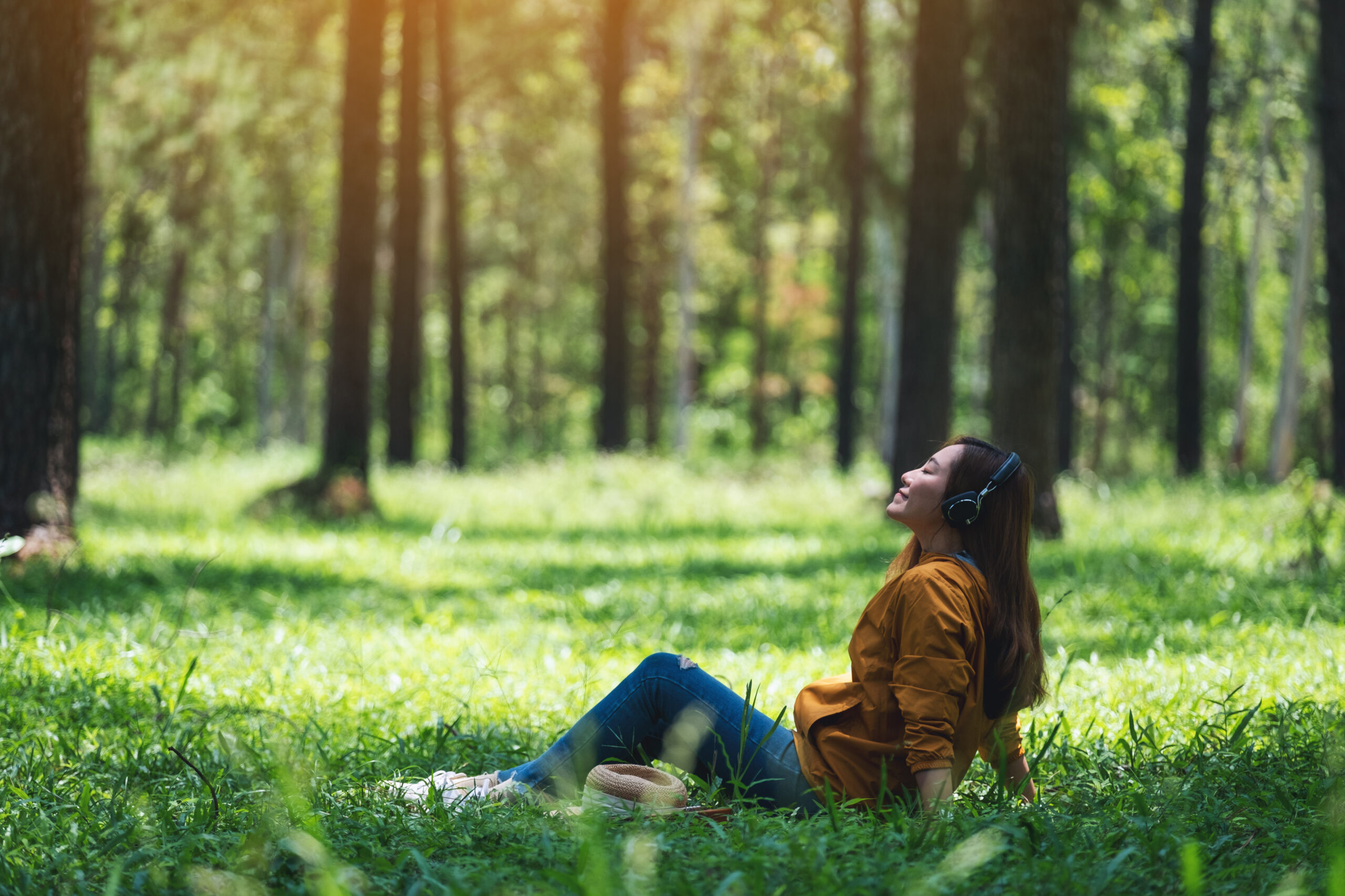 Woman in field pondering the difference between ketamine clinics and traditional therapy