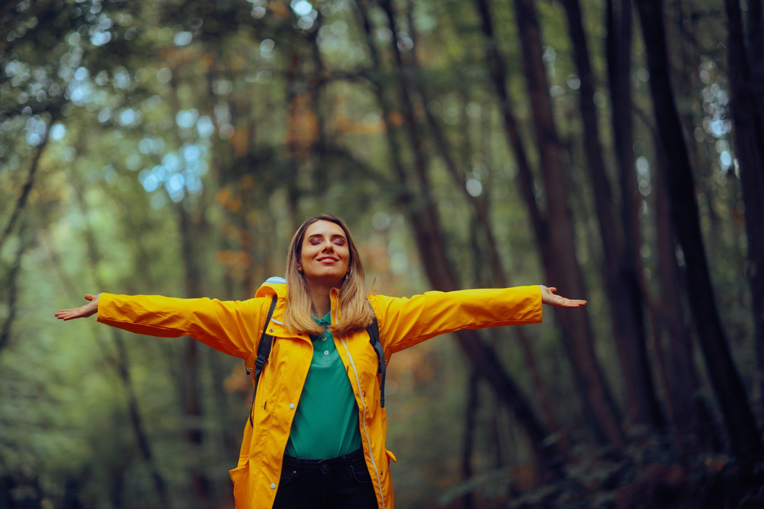 Woman in forest enjoying life after treatment for anxious depression